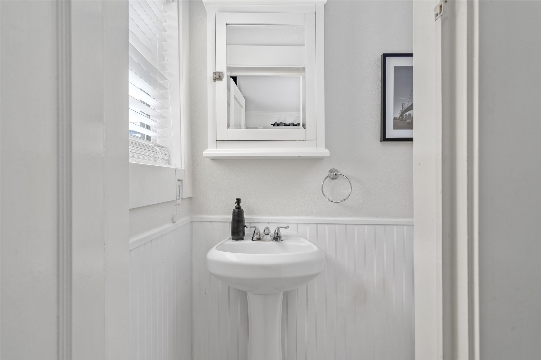 5302 Lindsay Street Houston, TX 77023 - Photo 16 of 37 a bathroom with a sink and a mirror