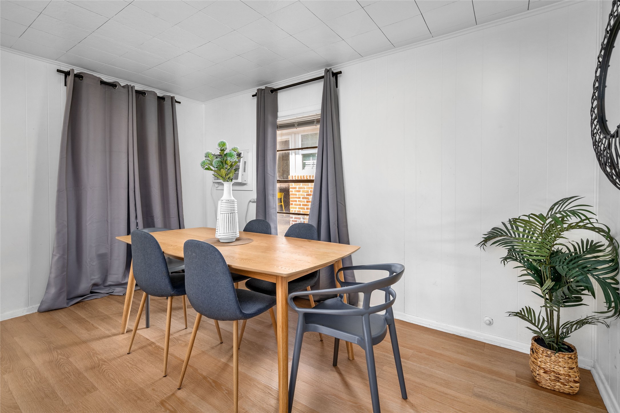 5302 Lindsay Street Houston, TX 77023 - Photo 21 of 37 a view of a dining room with furniture window and wooden floor
