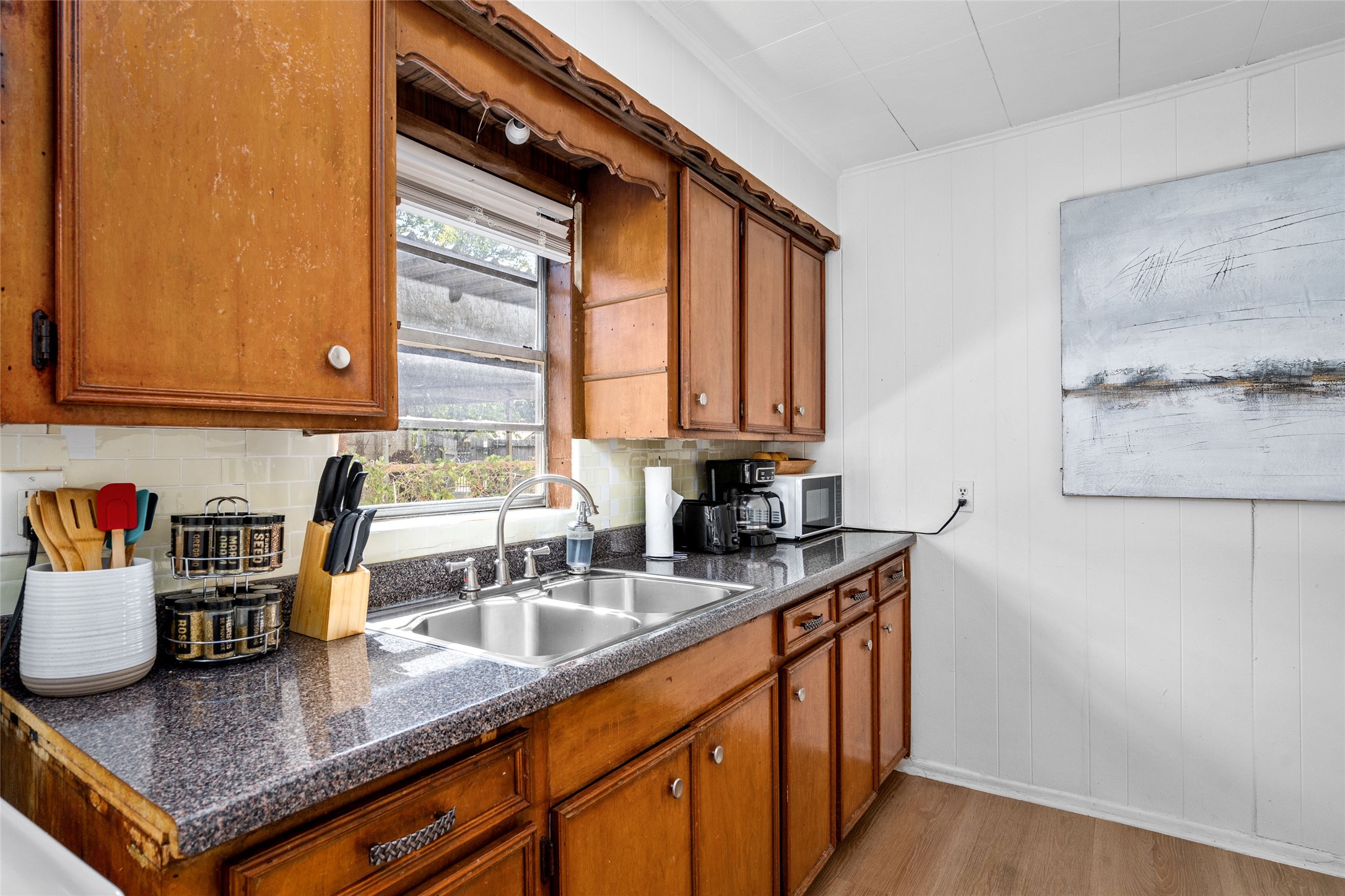 5302 Lindsay Street Houston, TX 77023 - Photo 25 of 37 a kitchen with stainless steel appliances granite countertop a sink a stove and a wooden cabinets