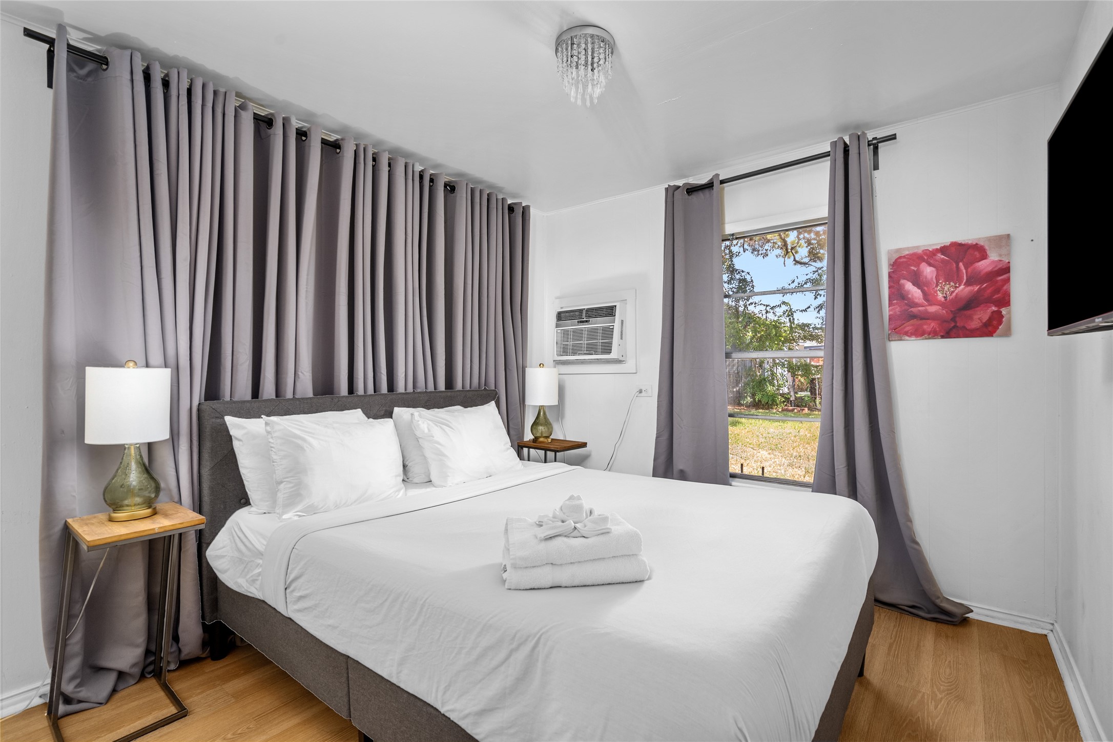 5302 Lindsay Street Houston, TX 77023 - Photo 26 of 37 a bedroom with a bed and a window