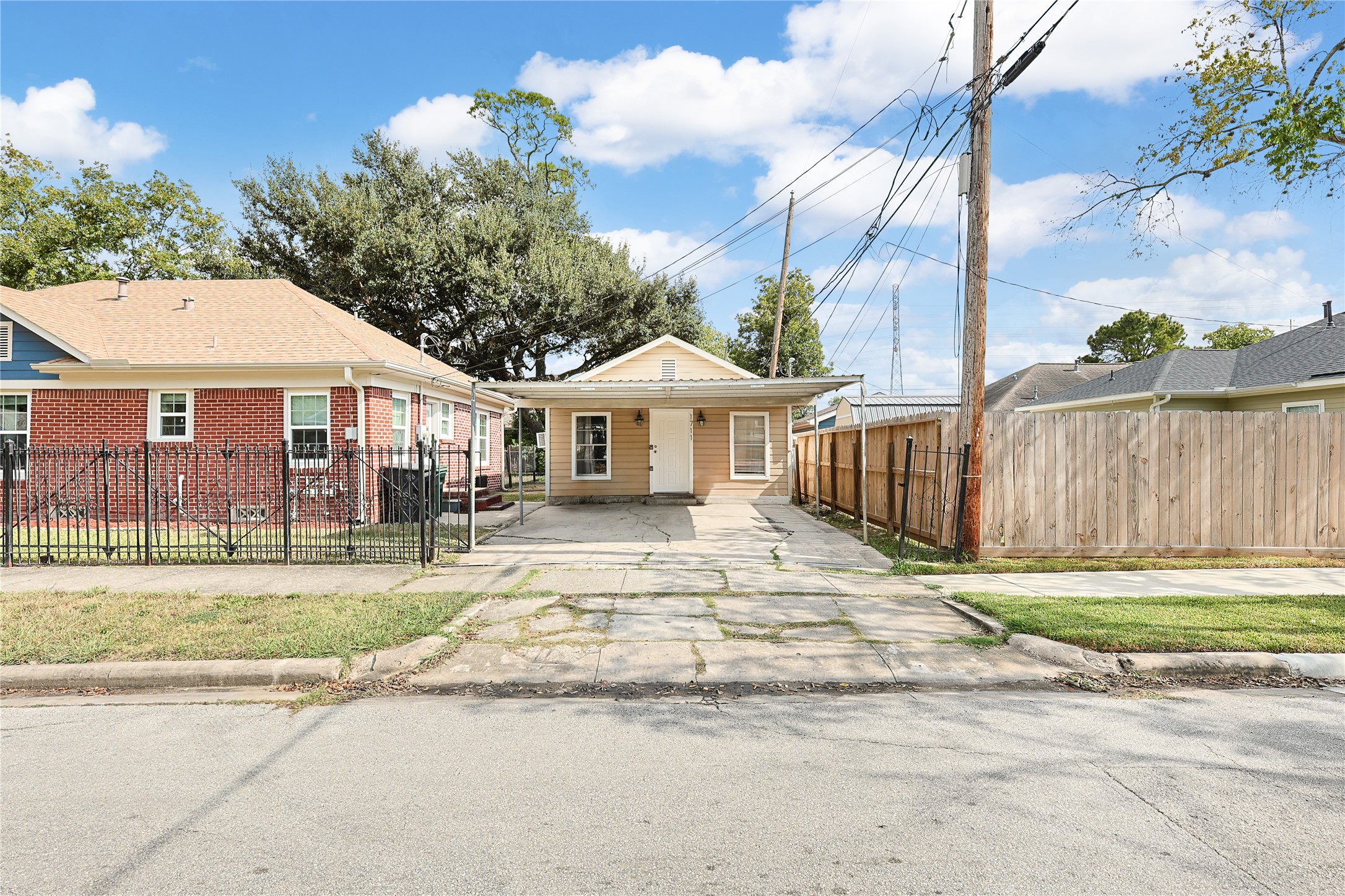 5302 Lindsay Street Houston, TX 77023 - Photo 32 of 37 a front view of a house with a garden and trees