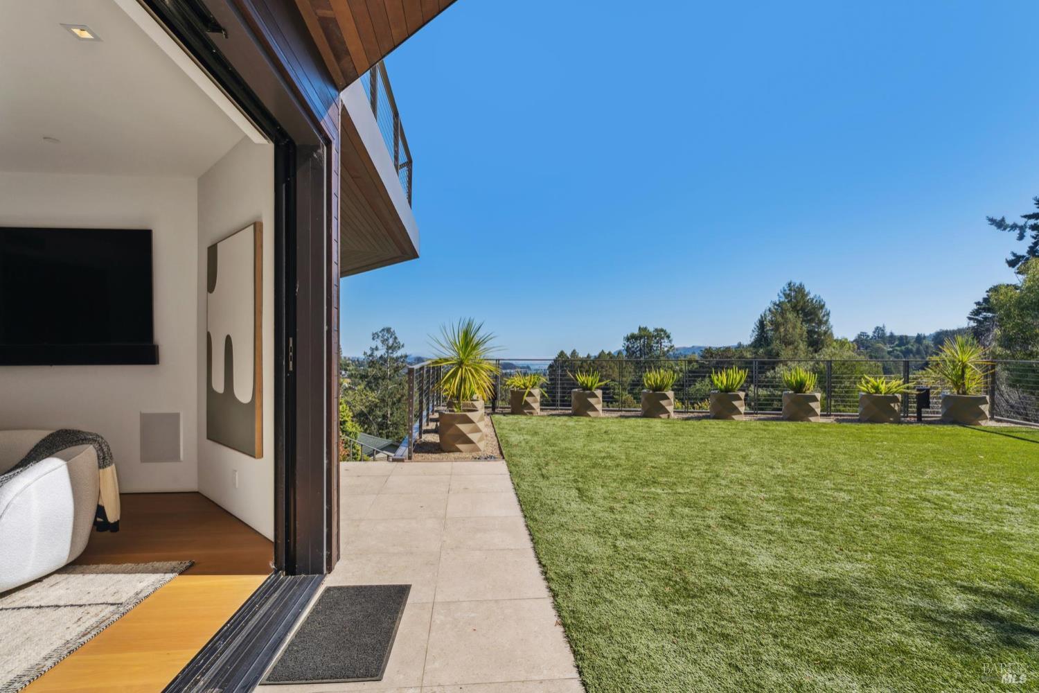 2 Upper Alcatraz Place Mill Valley, CA 94941 - Photo 29 of 42 a view of a balcony with floor to ceiling windows and yard