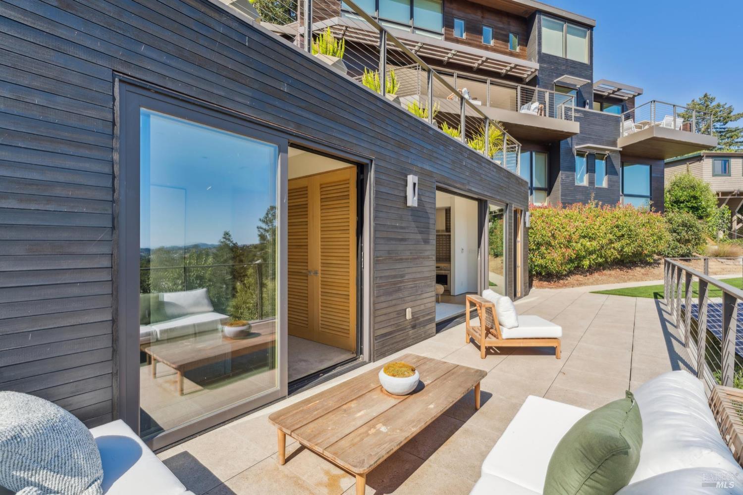 2 Upper Alcatraz Place Mill Valley, CA 94941 - Photo 33 of 42 a view of a patio with couches table and chairs and potted plants
