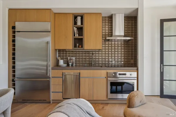 a kitchen with a stove and a refrigerator