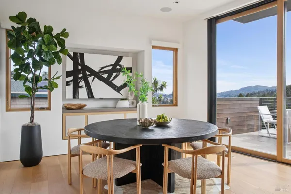 a view of a dining room with furniture window and outside view