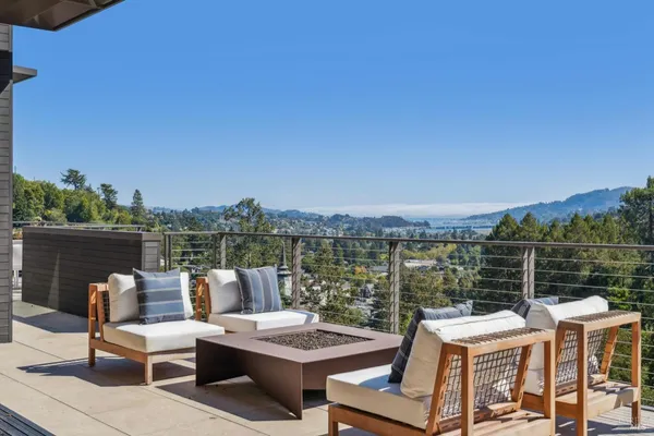 a view of a lake with furniture