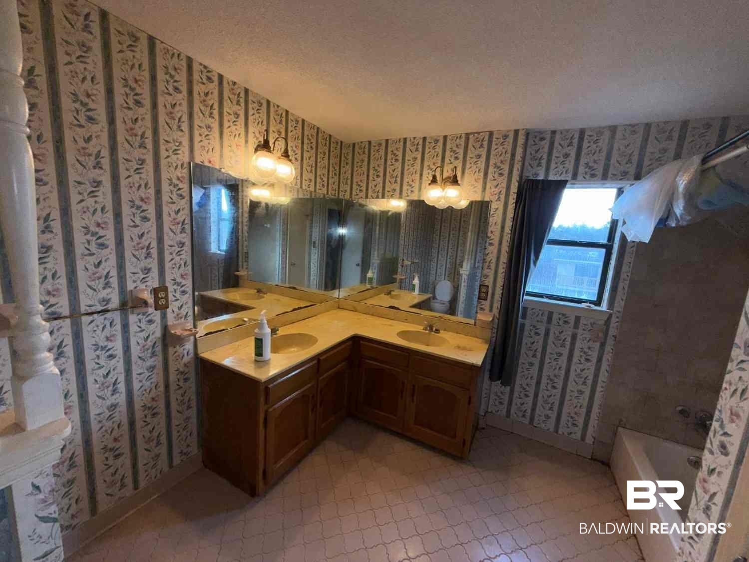 3721 Robertson Court Mobile, AL 36693 - Photo 13 of 22 Full bath featuring wallpapered walls, double vanity, and light tile patterned flooring
