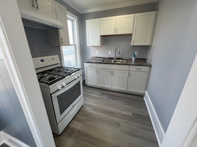1414 Plymouth Avenue, Unit 2 Fall River, MA 02721 - Photo 4 of 7 a kitchen with granite countertop white cabinets and white appliances