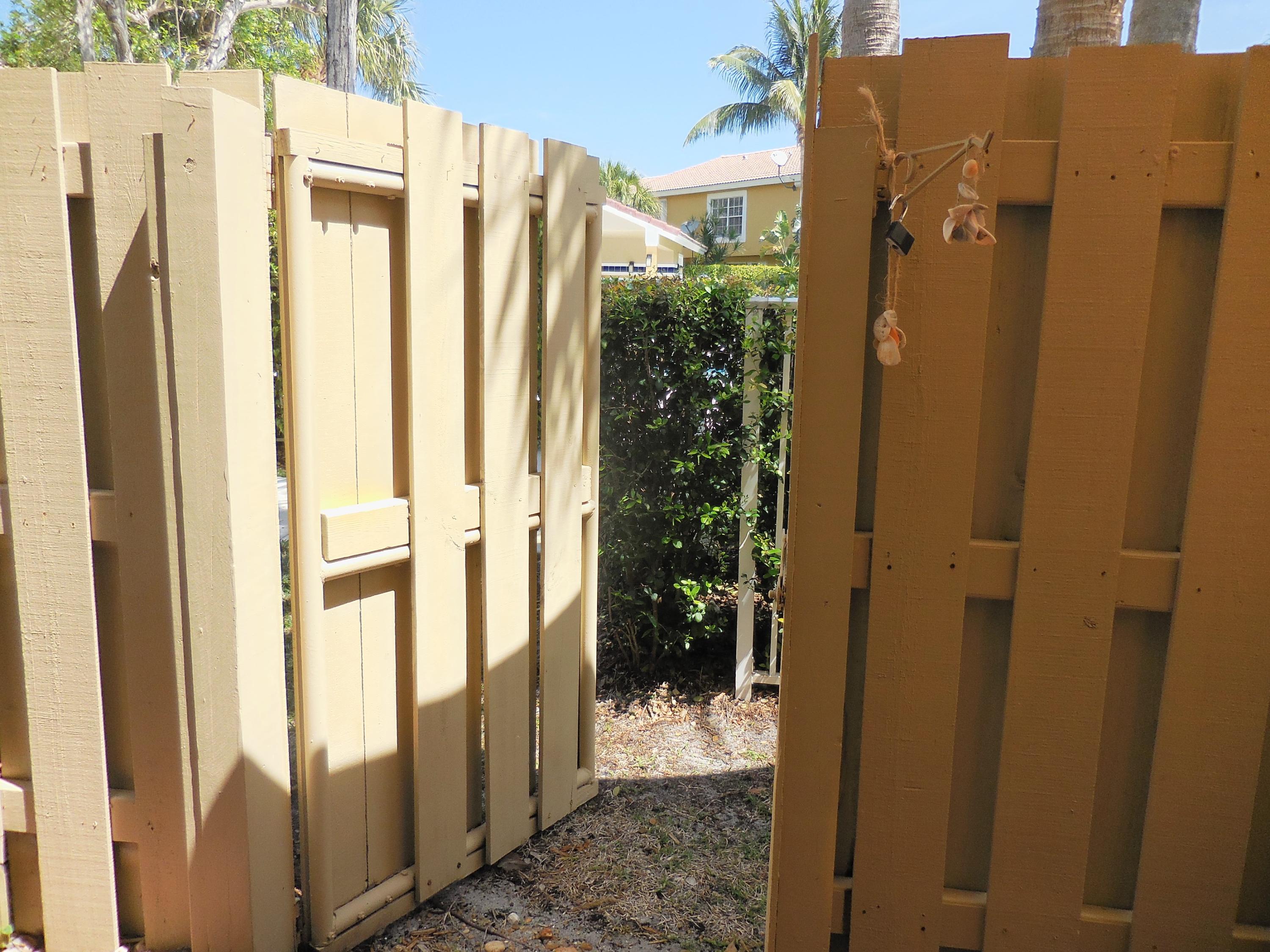 1002 Jeffery Street Boca Raton, FL 33487 - Photo 13 of 42 Fence and gate
