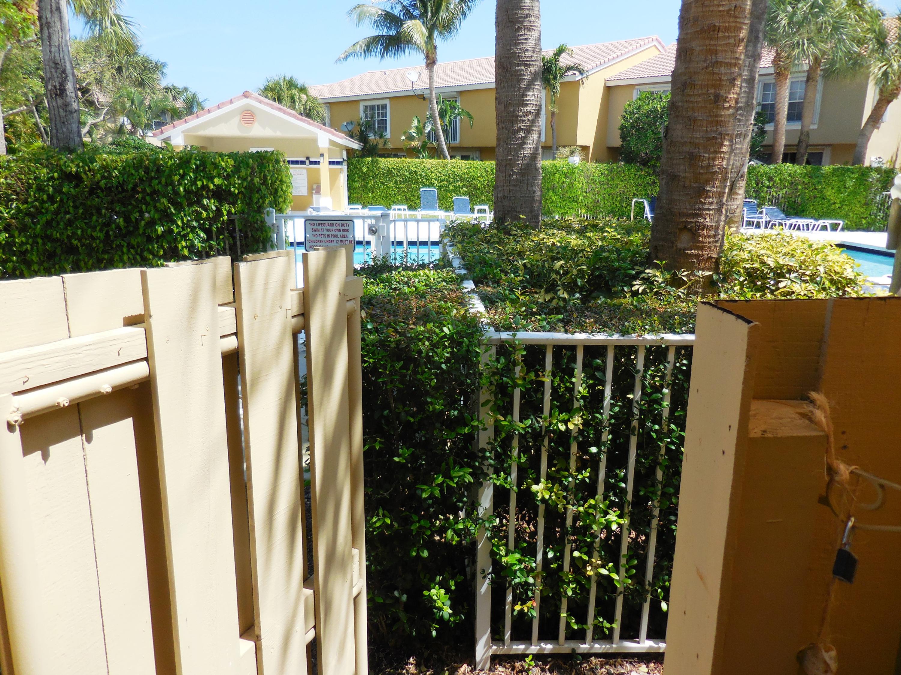 1002 Jeffery Street Boca Raton, FL 33487 - Photo 14 of 42 fence, pool behind it