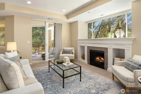 a living room with furniture kitchen view and a table
