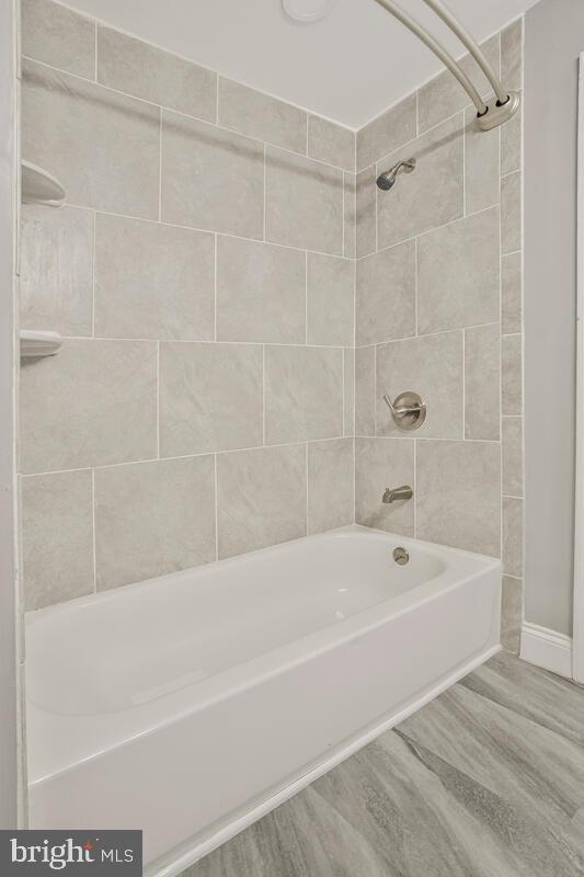 823 Newington Avenue Baltimore, MD 21217 - Photo 12 of 30 a bathroom with a bathtub and a shower