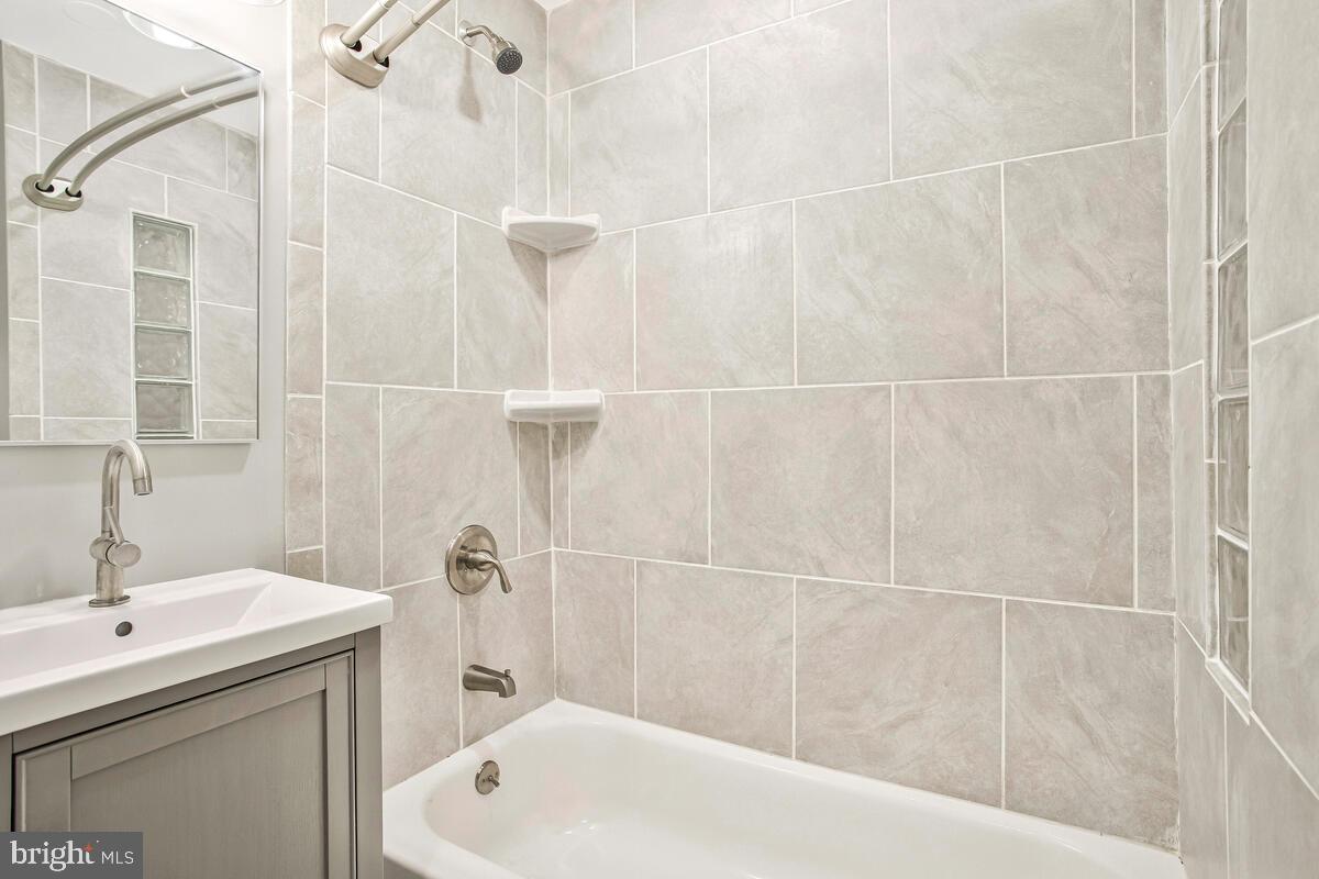 823 Newington Avenue Baltimore, MD 21217 - Photo 26 of 30 a bathroom with a sink a toilet and shower