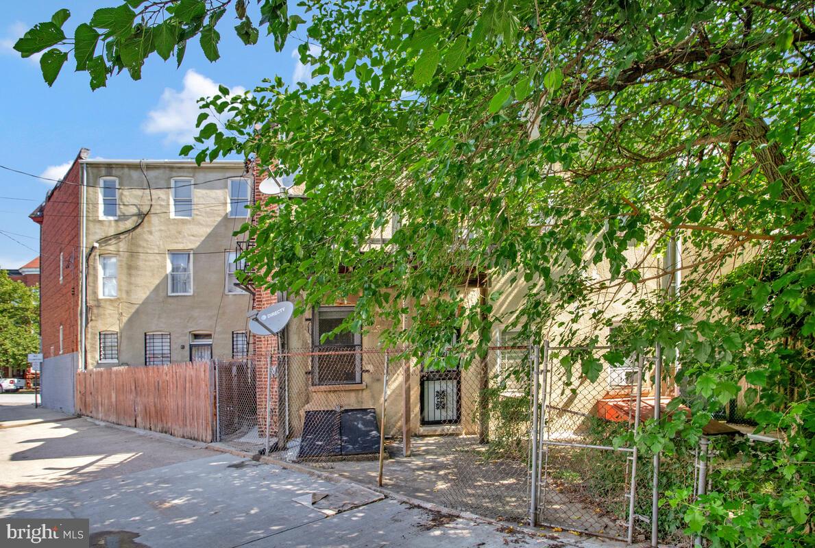 823 Newington Avenue Baltimore, MD 21217 - Photo 30 of 30 a front view of a house with a tree
