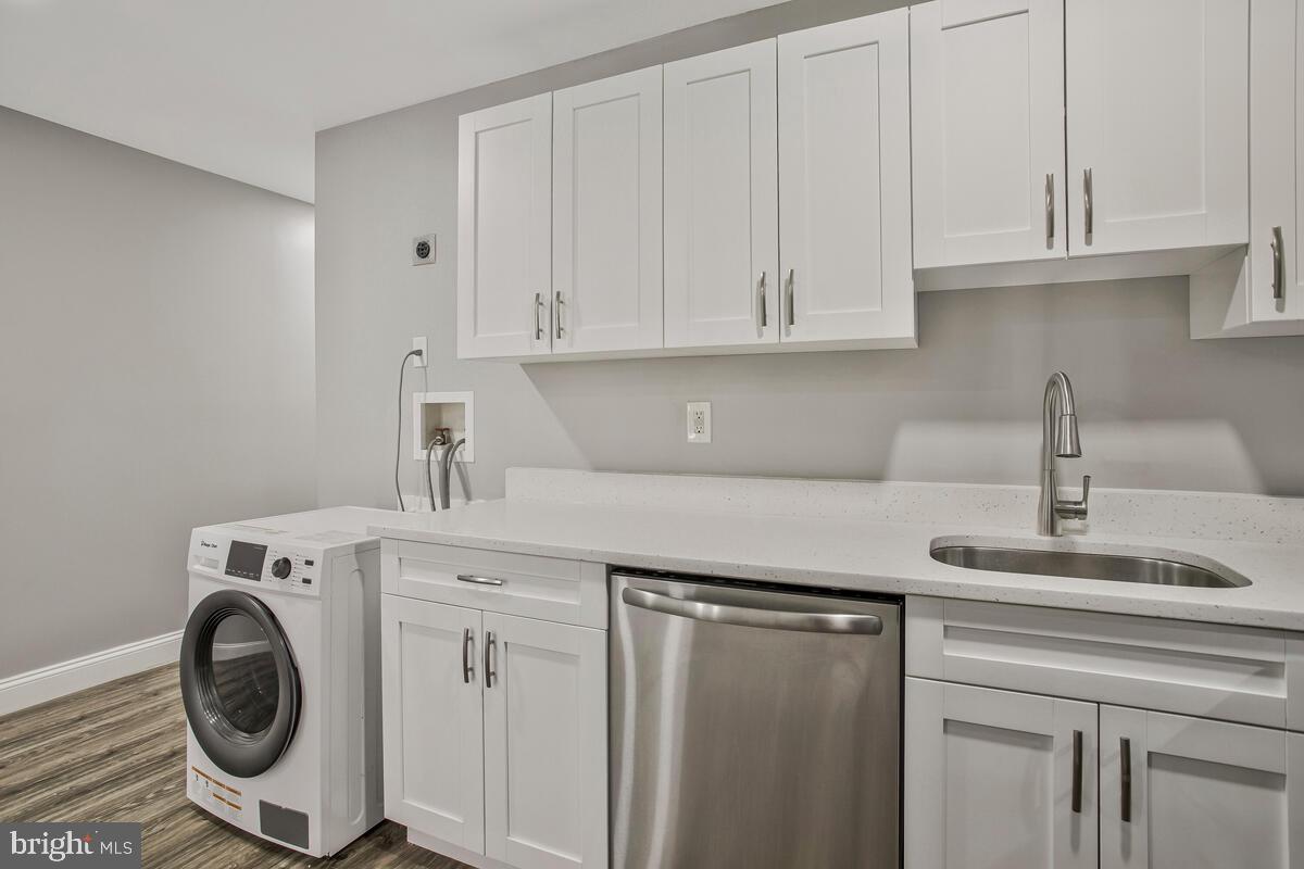 823 Newington Avenue Baltimore, MD 21217 - Photo 8 of 30 a kitchen with a sink and a stove top oven