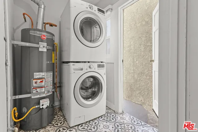 a close view of a utility room with dryer and washer