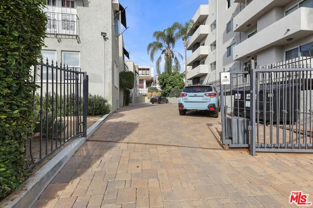 a view of street with parked cars