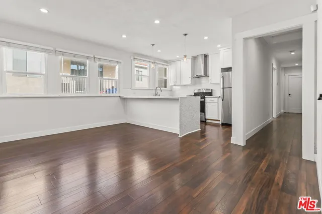 a view of kitchen with wooden floor and window