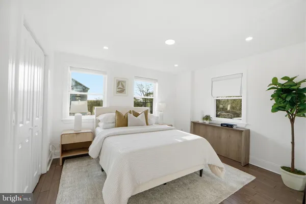 a bedroom with a bed and a couch