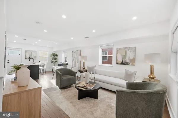 a living room with furniture and a table