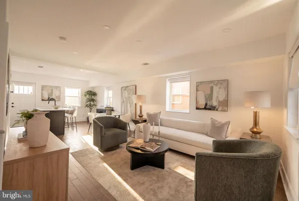 a living room with furniture and a table
