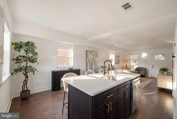 a kitchen with a sink and a stove