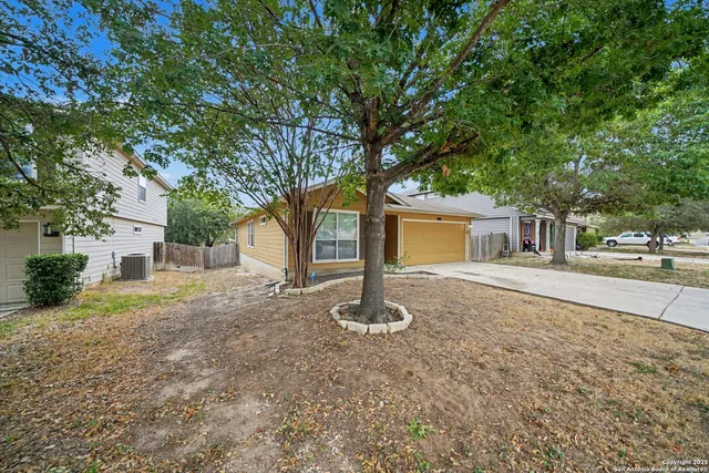 a house view with a backyard space