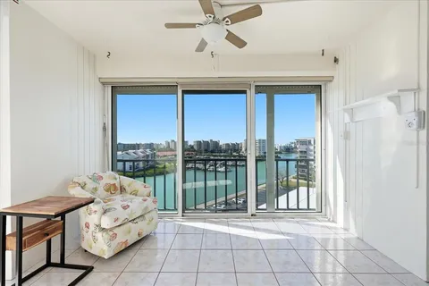 a spacious bedroom with a bed and a chandelier