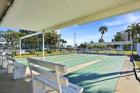 a view of swimming pool with seating area and furniture
