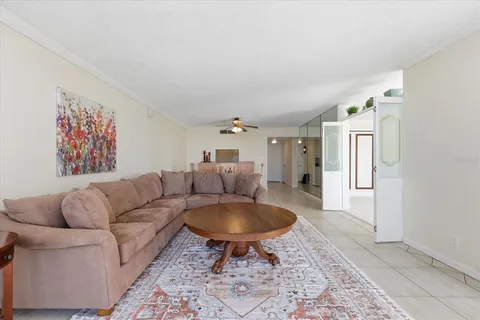 a living room with furniture and a rug