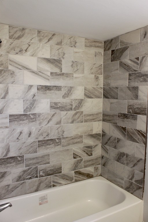 4 Jon Street Salisbury, MA 01952 - Photo 12 of 27 a bathroom with a bathtub