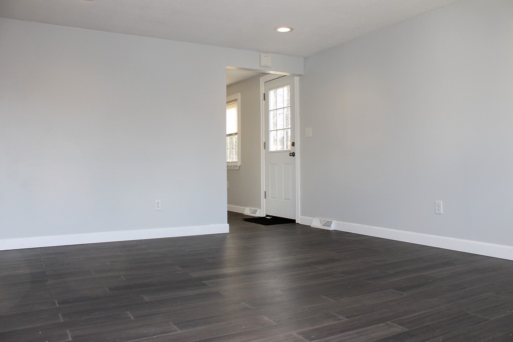 4 Jon Street Salisbury, MA 01952 - Photo 16 of 27 a view of an empty room with wooden floor and closet