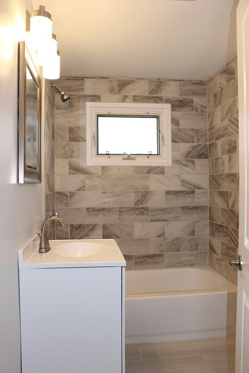 4 Jon Street Salisbury, MA 01952 - Photo 19 of 27 a bathroom with a sink and bathtub