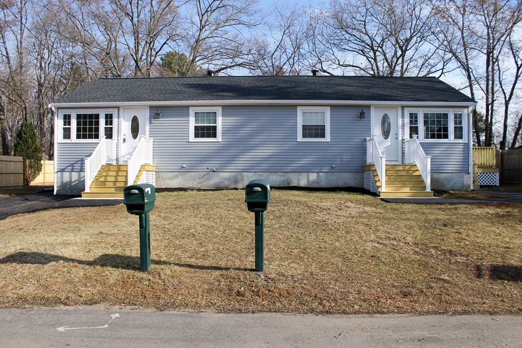 4 Jon Street Salisbury, MA 01952 - Photo 2 of 27 a front view of a house with garage