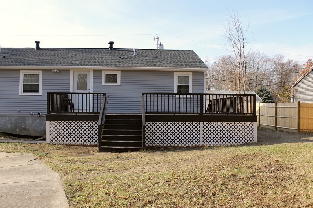 4 Jon Street Salisbury, MA 01952 - Photo 23 of 27 a front view of a house with a fence