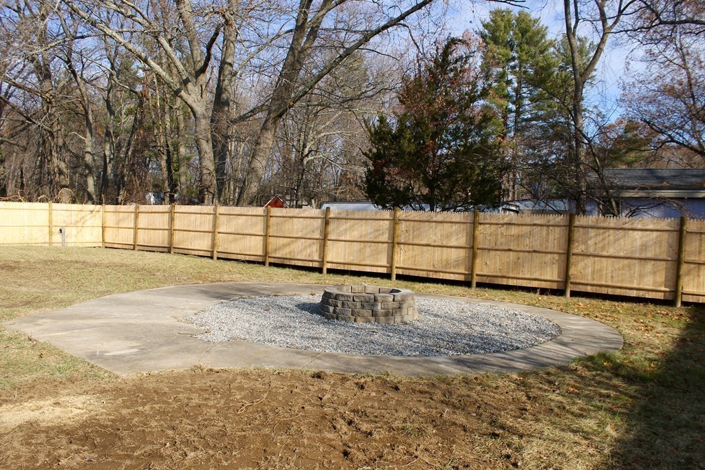 4 Jon Street Salisbury, MA 01952 - Photo 27 of 27 a view of a yard with wooden fence