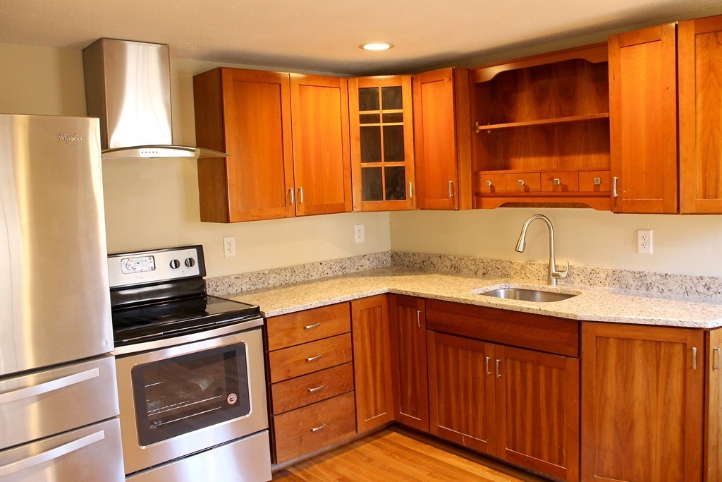 4 Jon Street Salisbury, MA 01952 - Photo 3 of 27 a kitchen with a sink stove and microwave