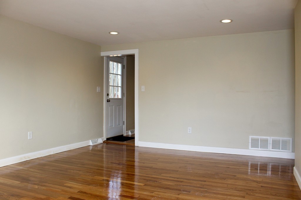 4 Jon Street Salisbury, MA 01952 - Photo 6 of 27 a view of empty room with wooden floor and fan