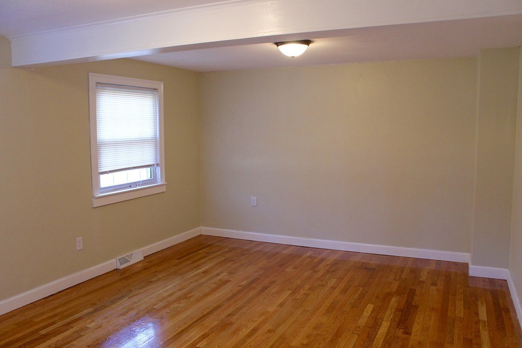 4 Jon Street Salisbury, MA 01952 - Photo 8 of 27 a view of an empty room with wooden floor and a window