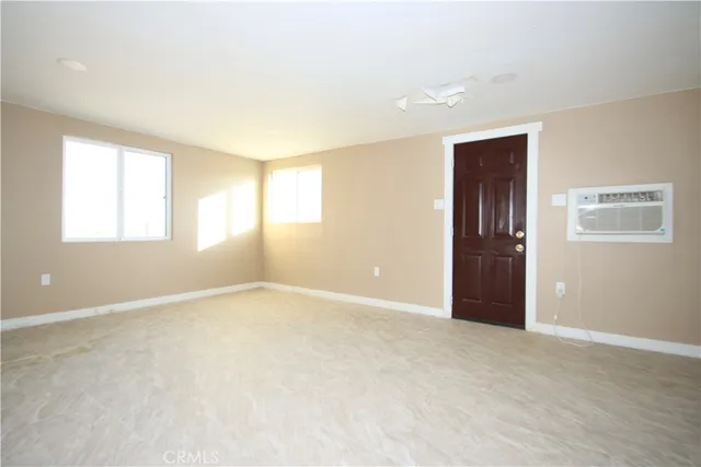 an empty room with closet area