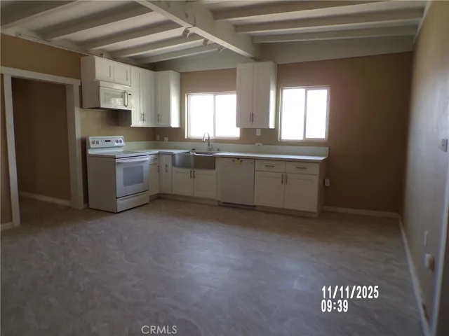 a view of empty room with fireplace