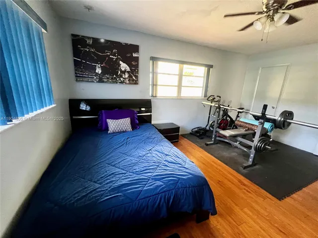 a bed room with a bed and a window