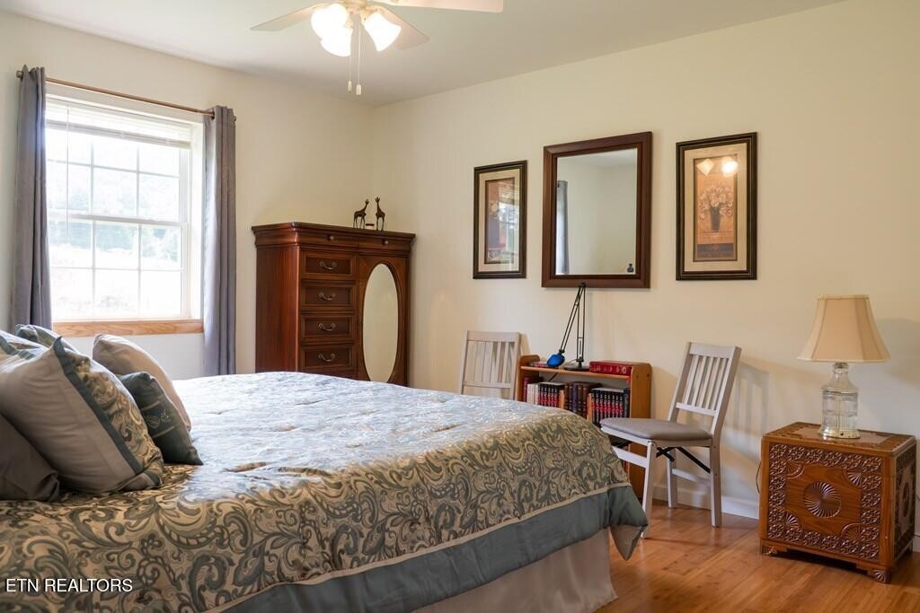 1518 Cummingsville And Sparkman Road Doyle, TN 38559 - Photo 18 of 58 a bedroom with a bed and a chair