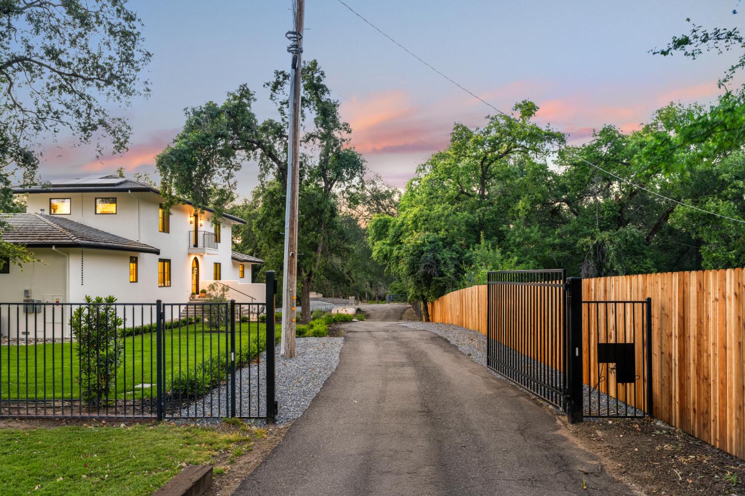 7697 Horseshoe Bar Road Loomis, CA 95650 - Photo 5 of 76 a view of a street with a small yard and a fountain