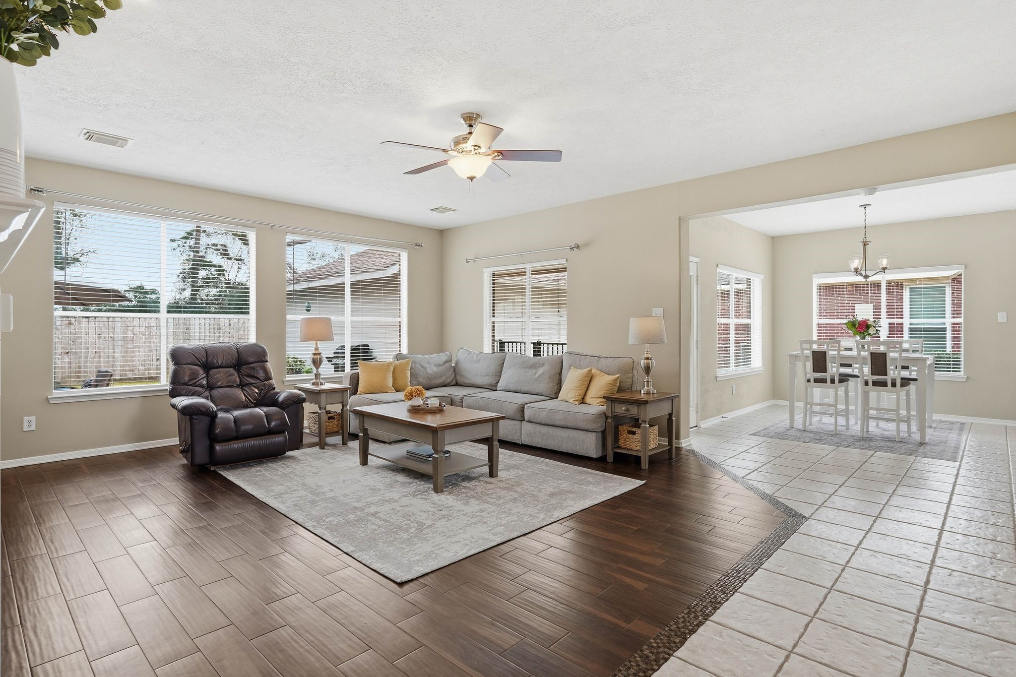 2515 Woodsboro Drive Spring, TX 77388 - Photo 10 of 44 This inviting living space features an open layout with a cozy seating area and abundant natural light. The adjacent dining area is well-lit and perfect for family meals.