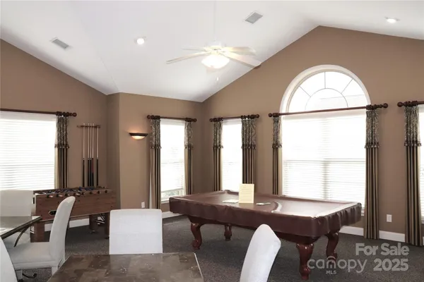 a view of a livingroom with furniture and window