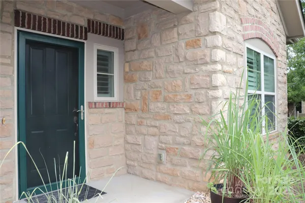 a brick house with a yard