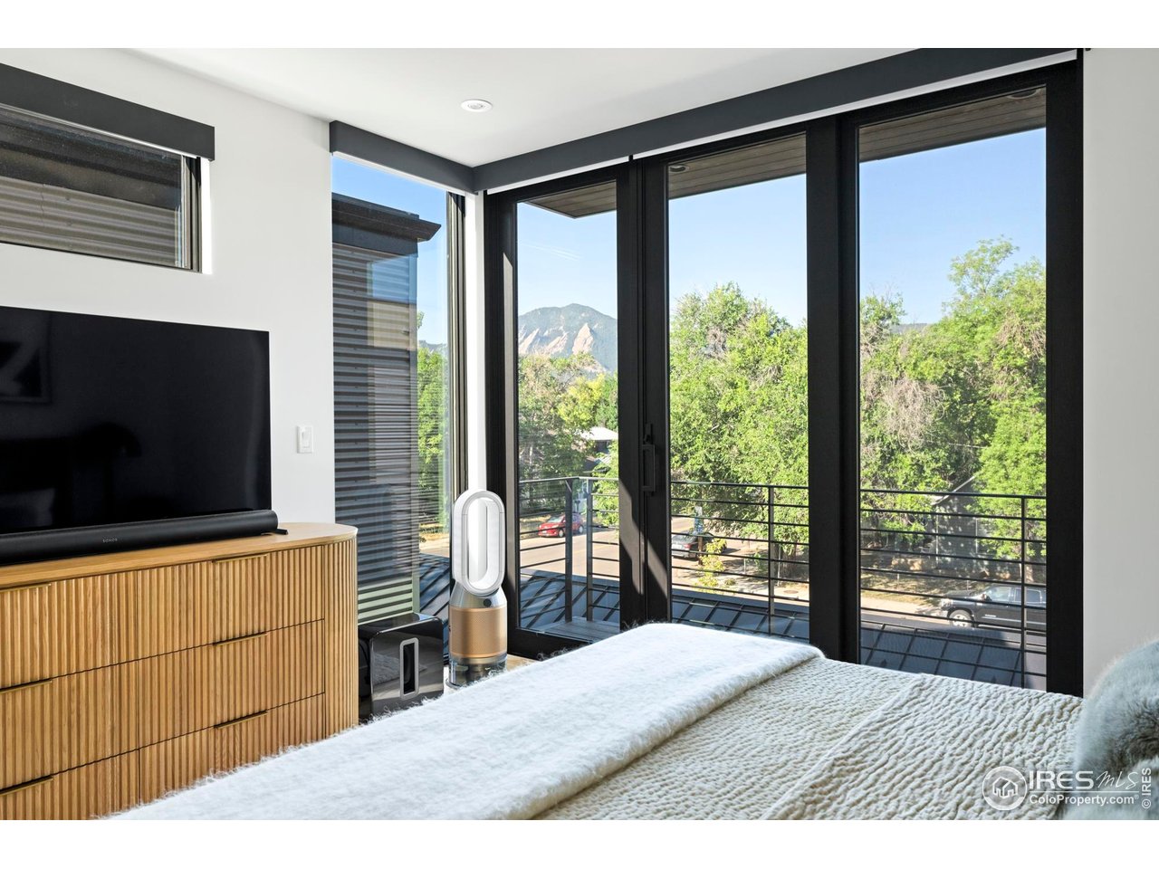 2709 Pine Street Boulder, CO 80302 - Photo 16 of 32 a living room with a large window and a flat screen tv