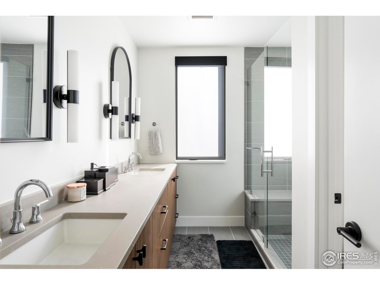 2709 Pine Street Boulder, CO 80302 - Photo 19 of 32 a bathroom with a sink a mirror and shower