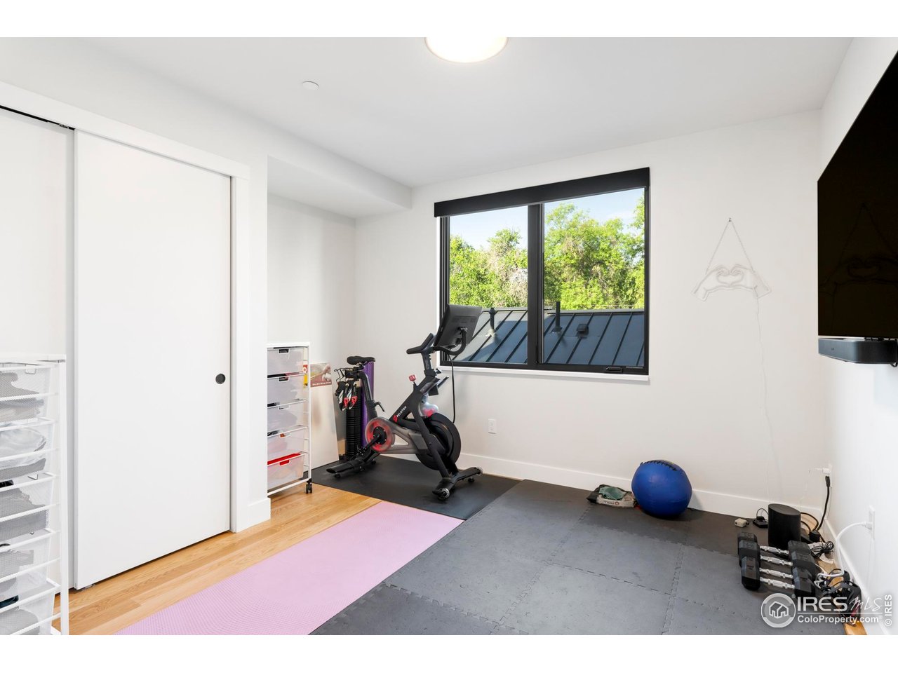 2709 Pine Street Boulder, CO 80302 - Photo 26 of 32 a view of a room with gym equipment and a large window